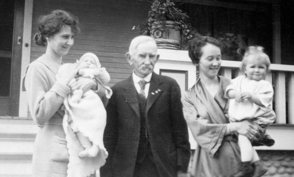  Isabelle Kennedy Stewart (second wife of Edward W. Murray); holding Madeline Stewart Murray (daughter of Edward W. Murray); Judge Edward W. Murray Sr.; Marjorie Murray (daughter of Edward W. Murray Sr.), holding Murray Harl Spencer (son of Marjorie Murray); ca. 1918.